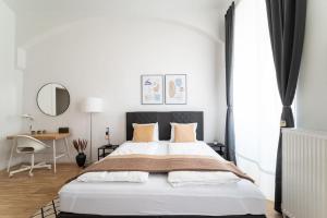 Letto o letti in una camera di Neat Studio Steps to Center by HM