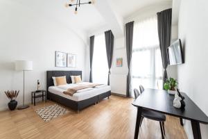 Letto o letti in una camera di Neat Studio Steps to Center by HM