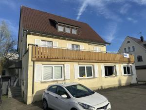 a small car parked in front of a house at Zäh in Meckenbeuren