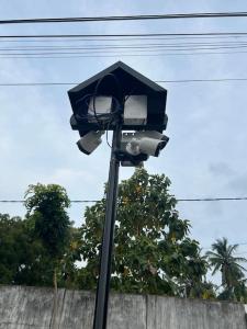 a street light with an umbrella on top of it at Augustin Guest House in Point Pedro