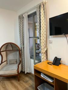 TV a/nebo společenská místnost v ubytování Adamas House Hotel Boutique