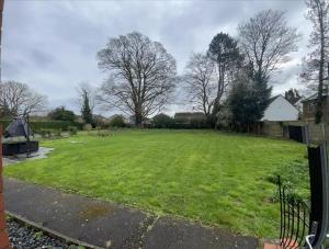 a large yard with a large grass field at Canford house on Westbury on Trym in Bristol