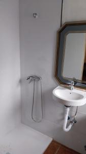 a bathroom with a sink and a mirror at Estudio 2 Hacienda Torrepalma in Torrepalma