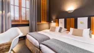 Llit o llits en una habitació de YoHo - The Young Hotel