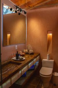 a bathroom with a sink and a mirror at La Hacienda Tepoztlán Awarded - Firenze Entremuros in Tepoztlán