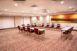 a conference room with a long table and chairs at Grand Aras Hotel & Suites in Istanbul