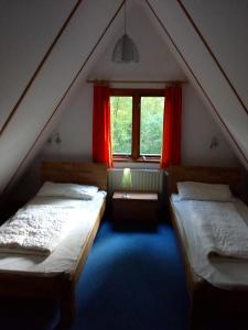Postel nebo postele na pokoji v ubytování Nurdachhaus Twistesee 126