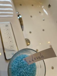 a glass bowl filled with blue beads next to a calculator at Landgasthof Waldeck in Stadtprozelten