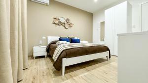 Postel nebo postele na pokoji v ubytování ARIA b&b