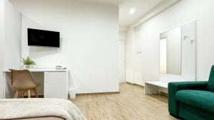 TV a/nebo společenská místnost v ubytování ARIA b&b