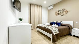 Postel nebo postele na pokoji v ubytování ARIA b&b