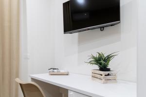TV a/nebo společenská místnost v ubytování ARIA b&b