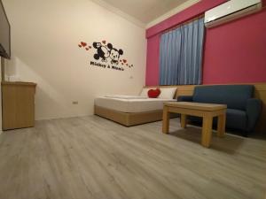Postel nebo postele na pokoji v ubytování Penghu Le You You Homestay