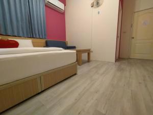Postel nebo postele na pokoji v ubytování Penghu Le You You Homestay