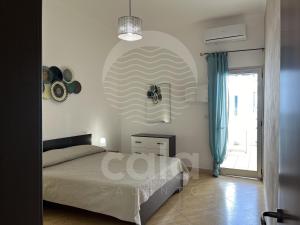Posteľ alebo postele v izbe v ubytovaní Casa del Marinaio - Fronte Mare By Cala Salento