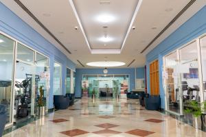 Fitness centrum a/nebo fitness zařízení v ubytování eStay Hotel