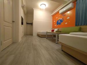 Postel nebo postele na pokoji v ubytování Penghu Le You You Homestay
