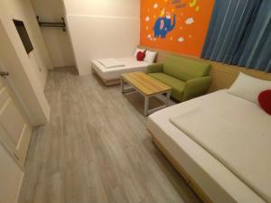 Postel nebo postele na pokoji v ubytování Penghu Le You You Homestay