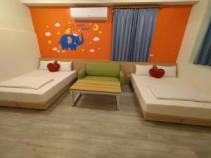 Postel nebo postele na pokoji v ubytování Penghu Le You You Homestay