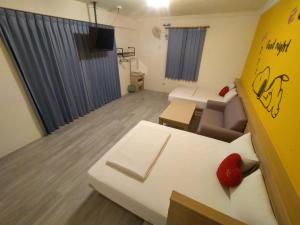 TV a/nebo společenská místnost v ubytování Penghu Le You You Homestay