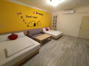 Postel nebo postele na pokoji v ubytování Penghu Le You You Homestay