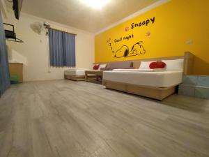 Postel nebo postele na pokoji v ubytování Penghu Le You You Homestay