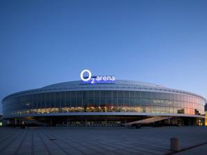 a large building with a sign on top of it at Stay2gether City Buzz Apt - O2 arena - Sleeps 6 in Prague