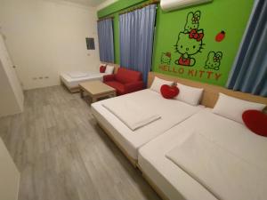 Postel nebo postele na pokoji v ubytování Penghu Le You You Homestay