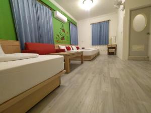 Postel nebo postele na pokoji v ubytování Penghu Le You You Homestay