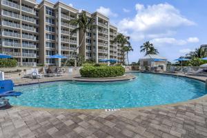 a pool in front of a large apartment building at Marco Beach Ocean Resort 601 in Marco Island