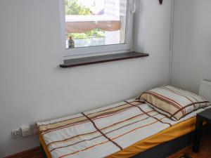 Llit o llits en una habitació de Apartment Parkowa-2 by Interhome
