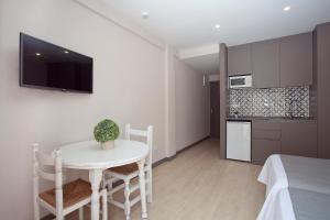 Kuchyň nebo kuchyňský kout v ubytování Apartamentos Ribera