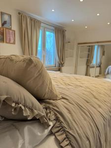 een bed met twee kussens in een slaapkamer bij The Cheerful Villa In Perstorp in Perstorp