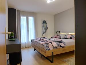 Postel nebo postele na pokoji v ubytování Apartment Beatrice Garden by Interhome