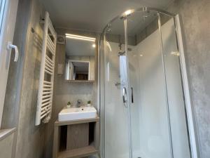 a bathroom with a shower and a sink at Holiday Home Carola by Interhome in Wemding