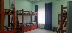 Postel nebo postele na pokoji v ubytování Hostel Korona