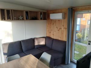 a living room with a couch and a table at Holiday Home Christian by Interhome in Wemding