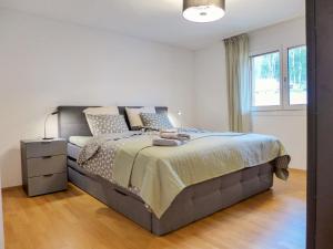 Säng eller sängar i ett rum på Apartment Ibex by Interhome