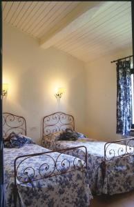 A bed or beds in a room at Poggio alle Vigne