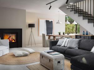 a living room with a couch and a fireplace at Villa Melon by Interhome in Poreč