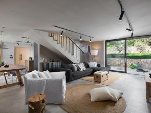 a living room with a couch and a table at Villa Melon by Interhome in Poreč