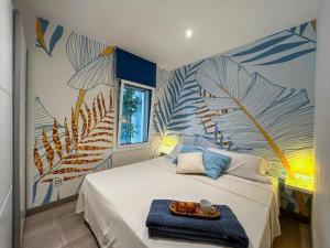 a bedroom with a bed with a tray of food on it at Apartment Mar D'Aro-2 by Interhome in Platja d'Aro