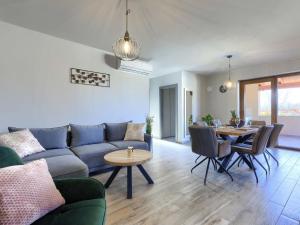 a living room with a couch and a table at Apartment Emili by Interhome in Vižinada