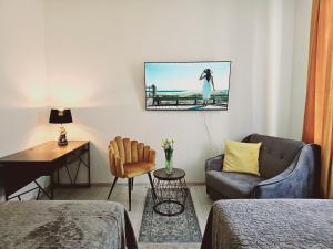 Televizorius ir (arba) pramogų centras apgyvendinimo įstaigoje Memel Stay apartments, Self check - in- Nemokamas parkingas