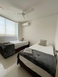 En eller flere senge i et værelse på Cartagena Seaview Elegance