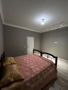 a bedroom with a large bed in a room at NURAS-APART in Kirovo