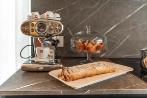 a plate of food sitting on a counter with a camera at B&B A Un Passo Dal Lago, Caldonazzo in Caldonazzo