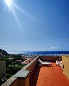 a balcony with a view of the ocean at Holiday Homes Marina in Punta Ala