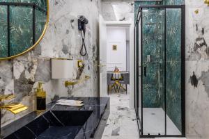 a bathroom with a shower and a black sink at Maison 31 -Luxury Apartments in Santa Marinella +100 photos