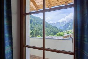 a window with a view of a mountain view at Mareiter Stein Blasighof in Racines